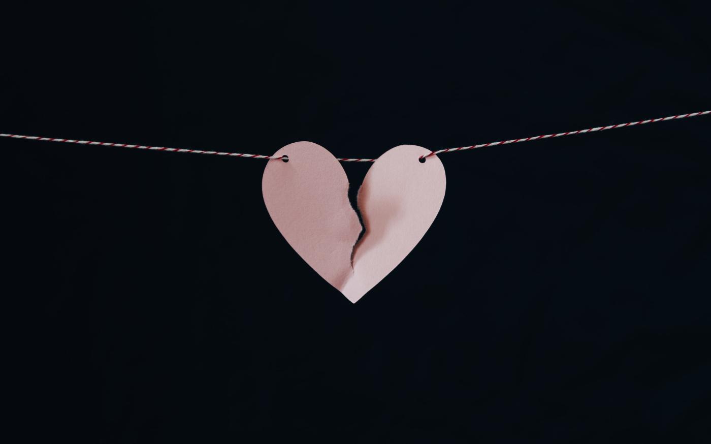 broken heart hanging on wire by Kelly Sikkema courtesy of Unsplash.