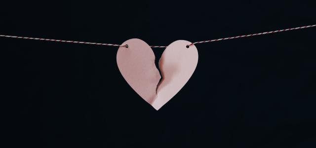 broken heart hanging on wire by Kelly Sikkema courtesy of Unsplash.